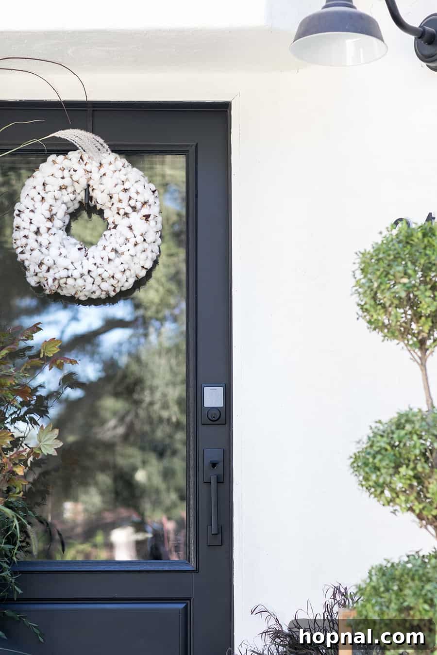 Black door with white wreath