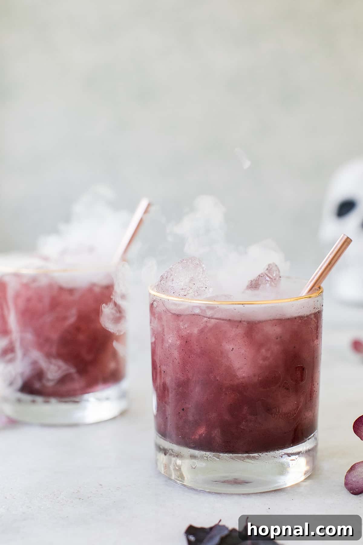 Witches Brew Gin Tonic 5 Halloween cocktail with a spooky dry ice effect, creating a smoking visual.