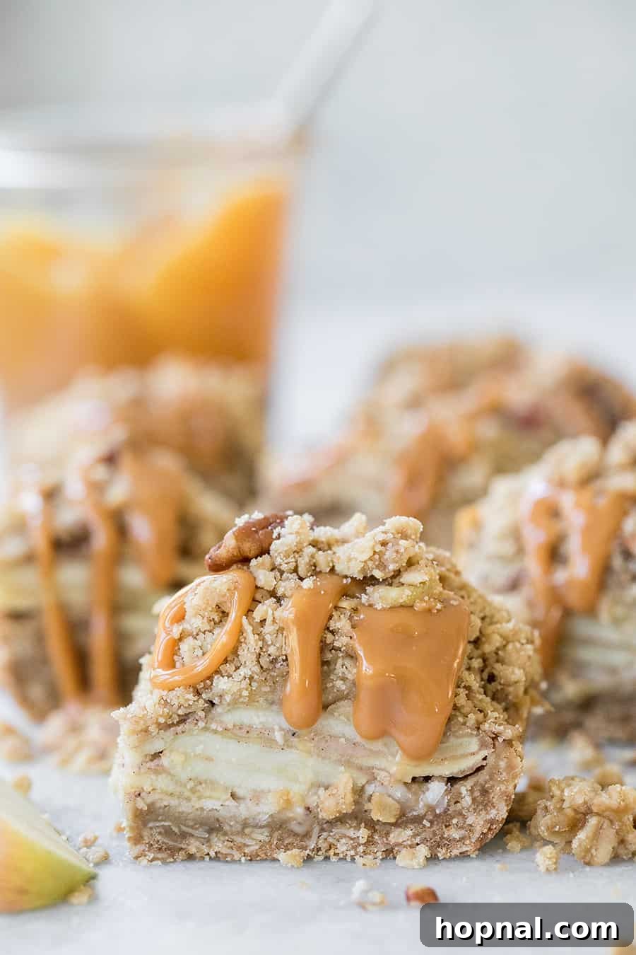 Ultimate Caramel Apple Crumble Bars 2 Layers of spiced apple filling and crunchy oatmeal crumble topping, drizzled with rich caramel sauce.