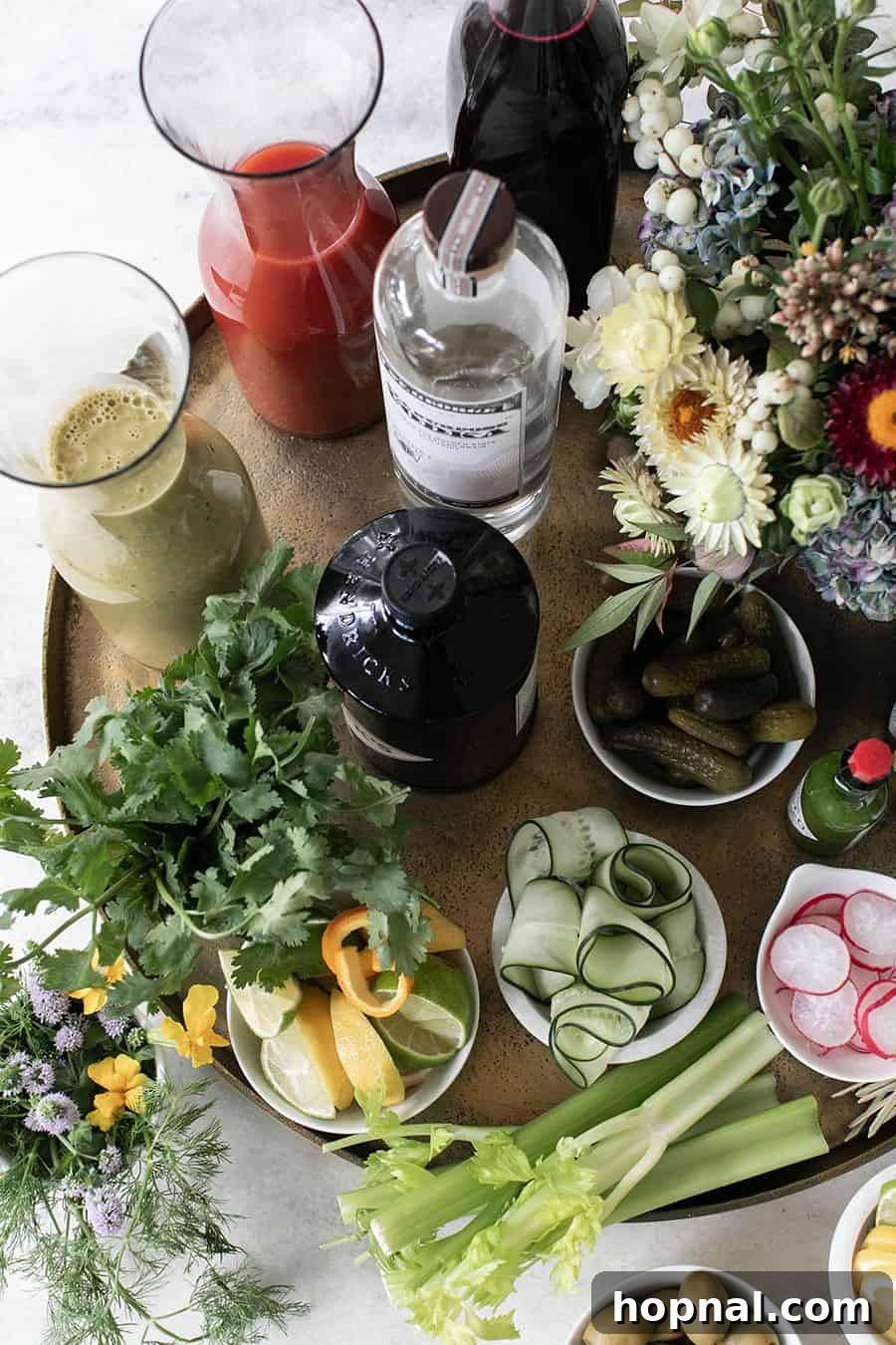 Craft Your Ultimate Home Bloody Mary Bar 6 An overhead perspective of a meticulously organized Bloody Mary bar, brimming with various ingredients.