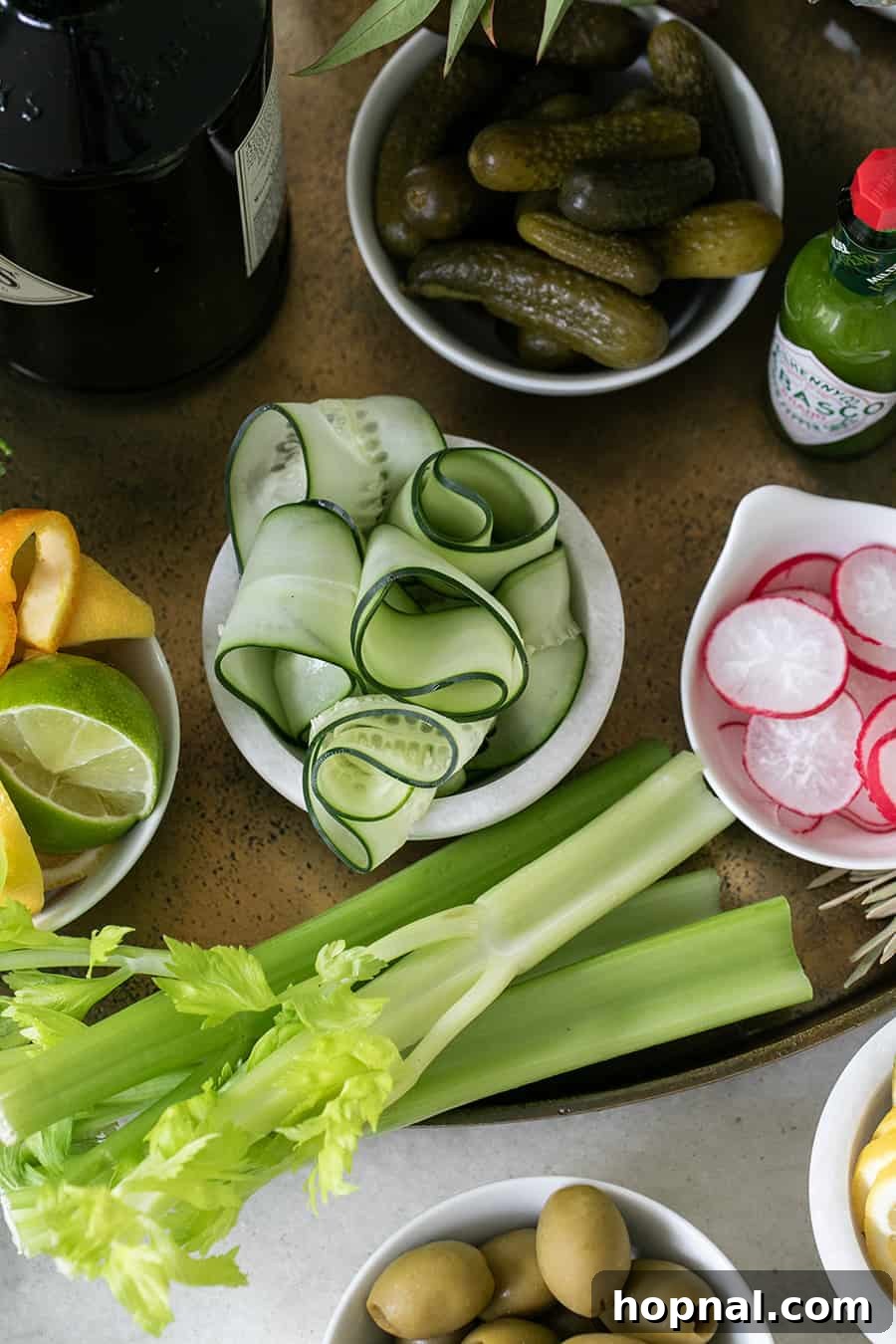 Craft Your Ultimate Home Bloody Mary Bar 7 Close-up of fresh celery and crisp cucumber slices, perfectly prepared for a homemade Bloody Mary bar.