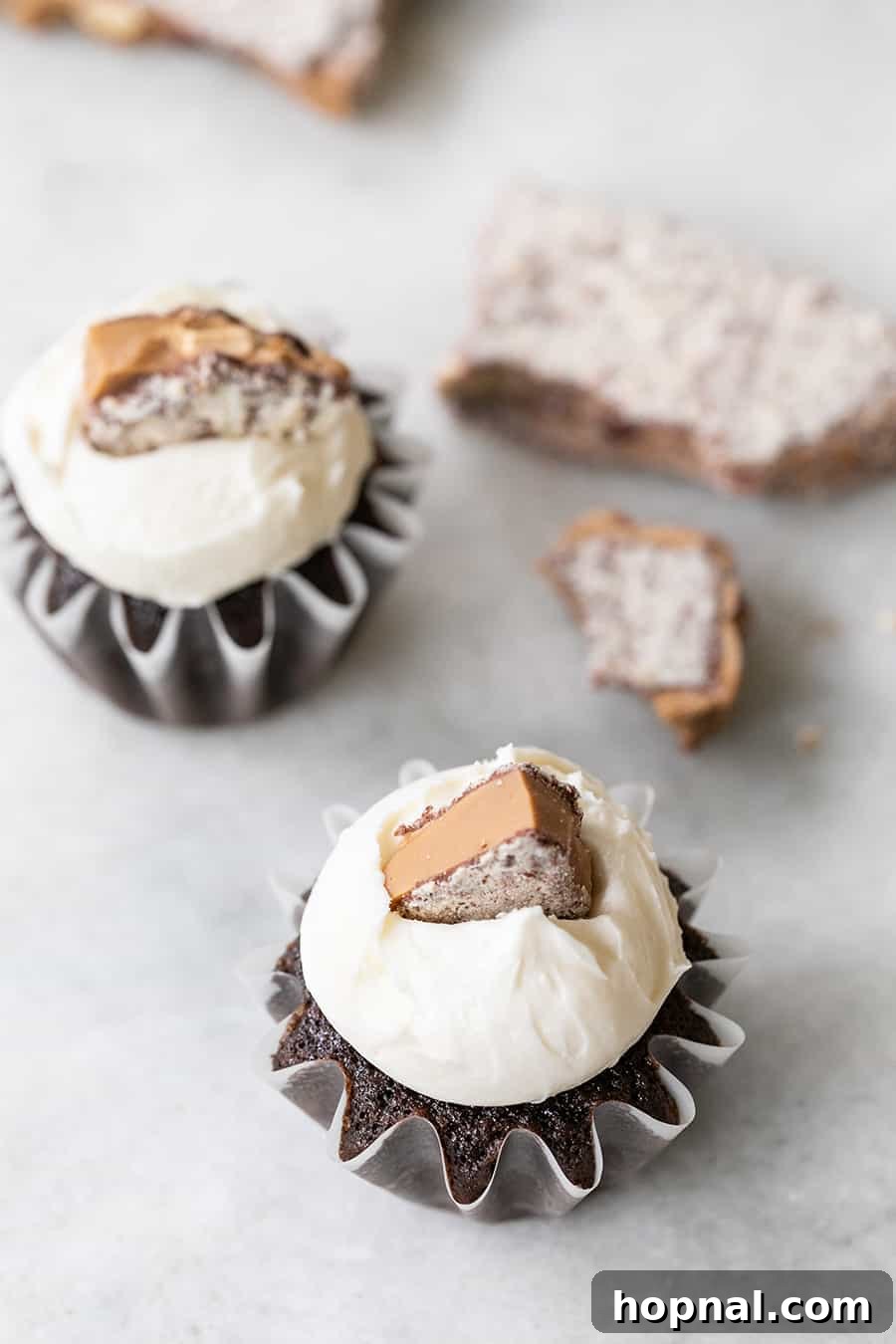Delicious chocolate cupcakes with melted toffee, cooling on a wire rack before frosting