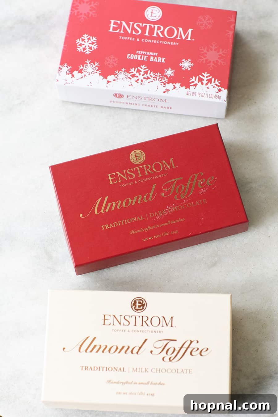 Elegant boxes of Enstrom Toffee, showcasing variety and premium packaging, perfect for gifting
