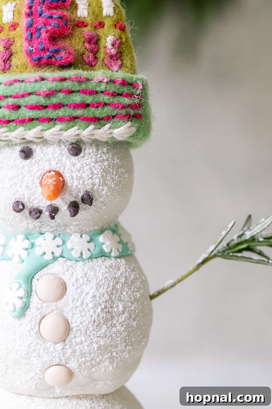 Gingerbread snowman cake decorated with powdered sugar