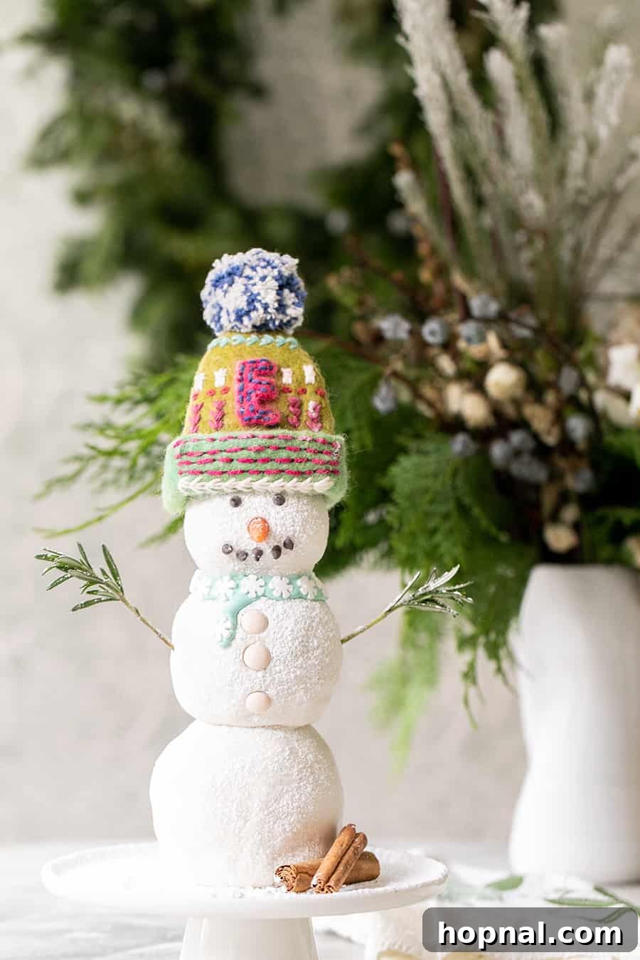 Gingerbread snowman cake with a real hat and scarf