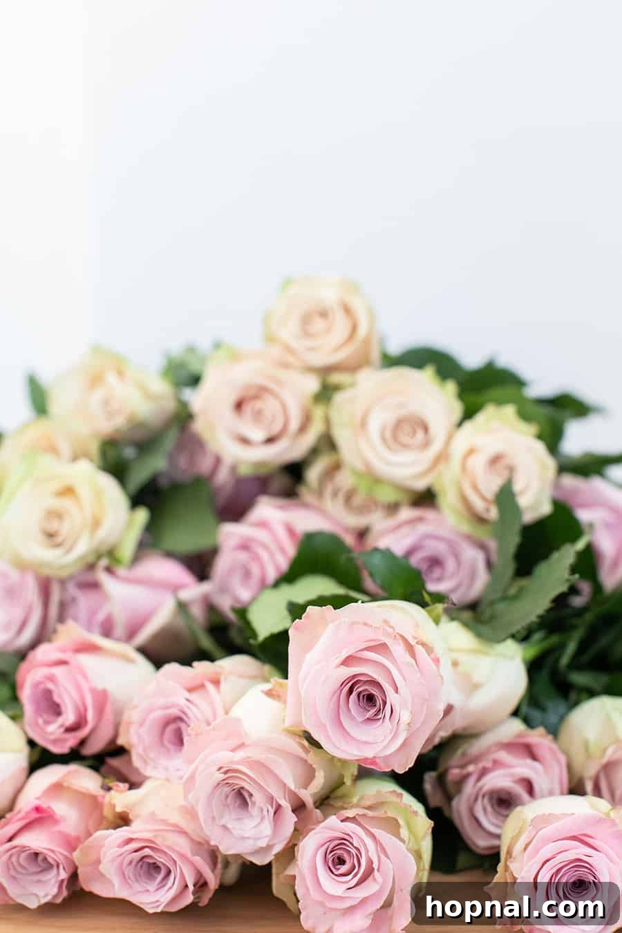 Twin Rose Elegance 3 A charming display of fresh roses artfully placed on a table setting