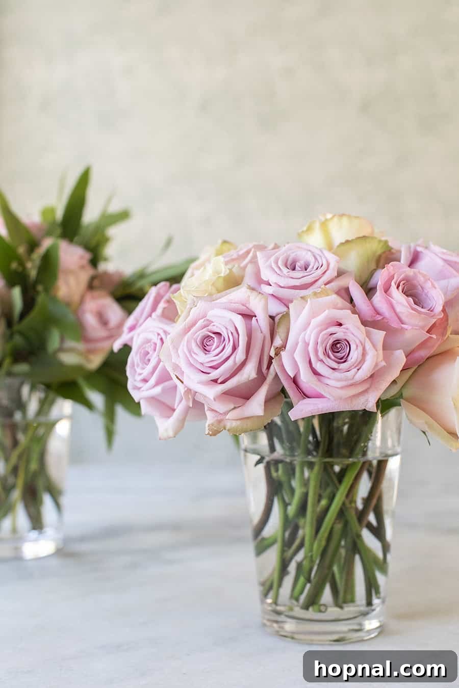 Twin Rose Elegance 9 A finished and stunning rose bouquet beautifully displayed in a vase