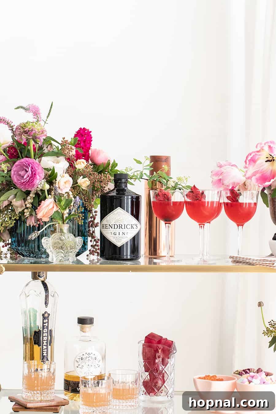The Gin Blossom Room 5 Gin and Flower Bar with cocktails, gin, ice cubes and candy.