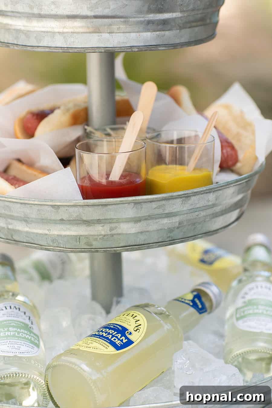 Elevate Your Decor: Tiered Galvanized Tray Ideas 4 A charming tiered galvanized tray featuring small bowls of ketchup and mustard, ready for a delicious BBQ spread.