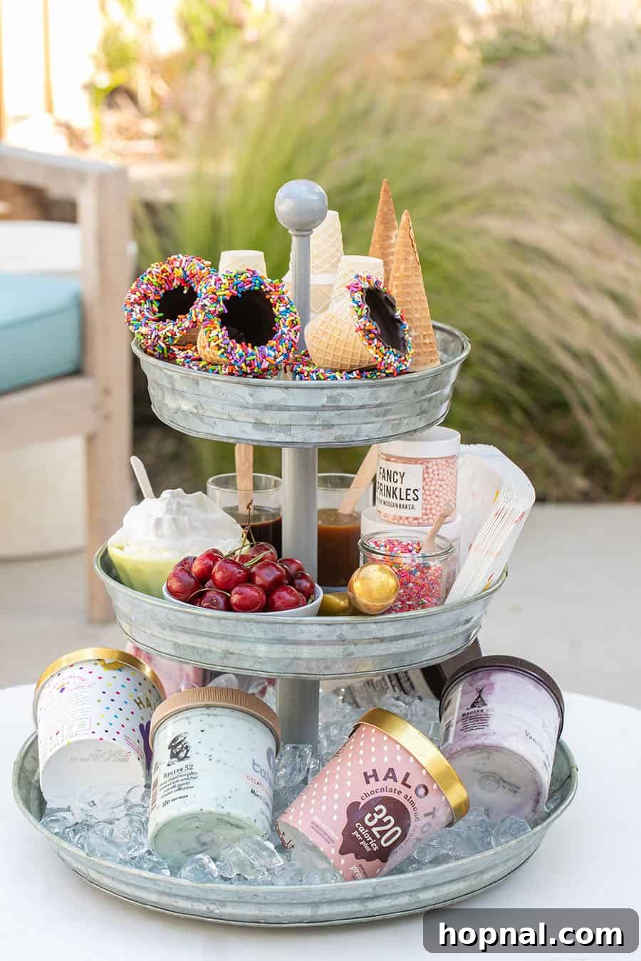 Elevate Your Decor: Tiered Galvanized Tray Ideas 8 A beautifully arranged tiered galvanized tray featuring ice cream cones on the top tier, an array of cherries and toppings in the middle, and various ice cream tubs kept cold on the bottom tier.