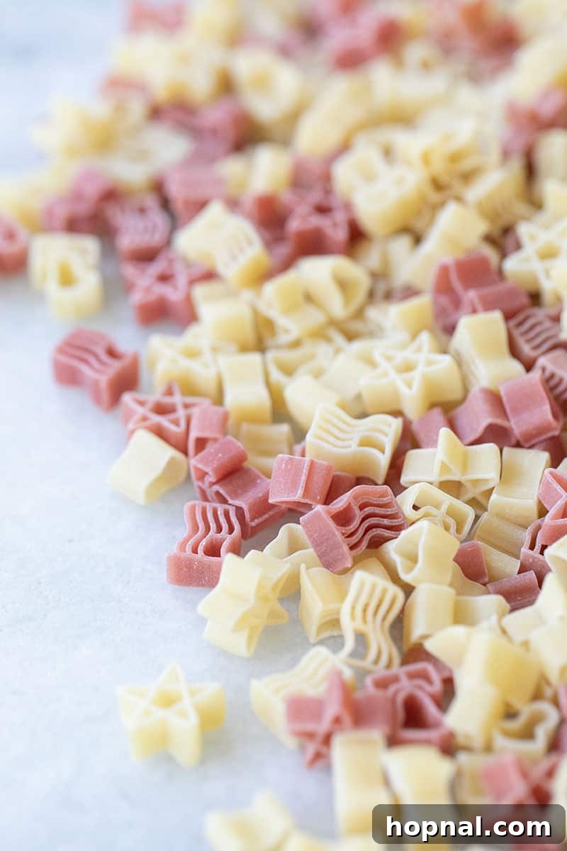 A close-up of red and white stars and stripes shaped pasta, showcasing its fun and festive design.