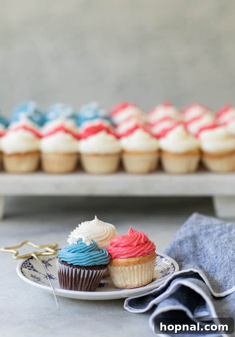 Assortment of mini cupcakes with red, blue, and white frosting
