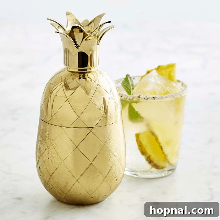 A decorative pineapple cocktail shaker, adding a whimsical touch to your bar setup.