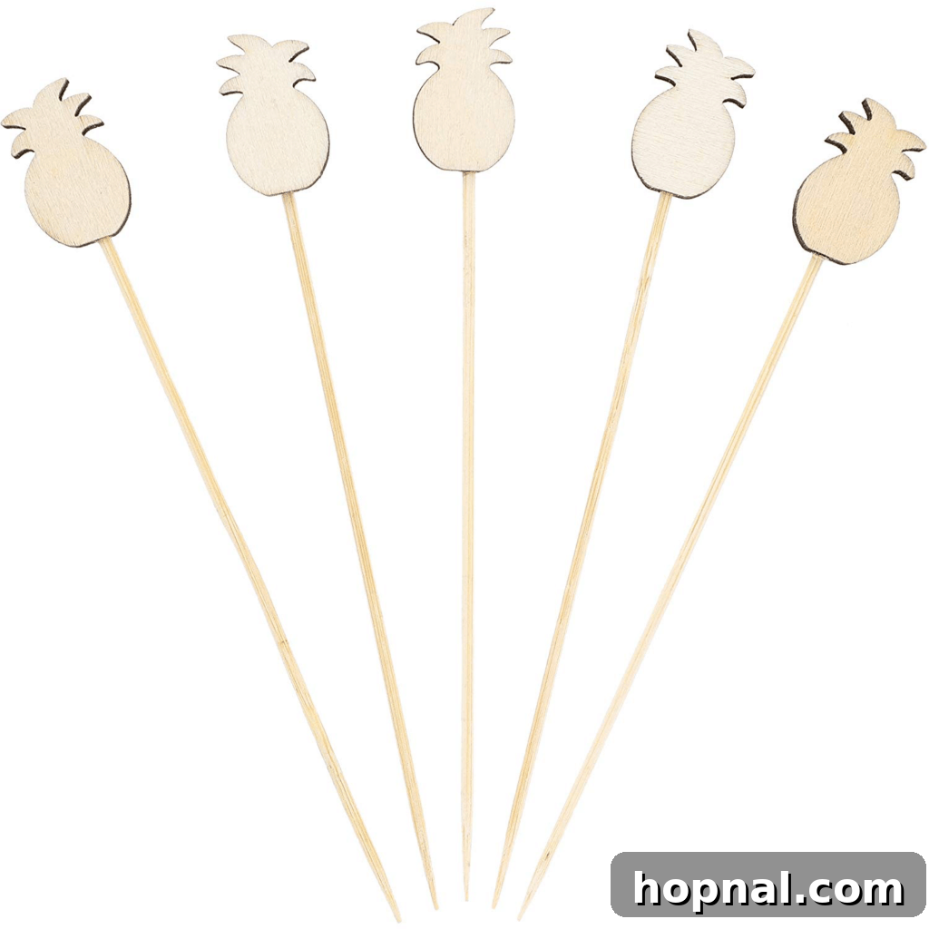 Decorative wooden pineapple picks, ideal for garnishing drinks or appetizers.