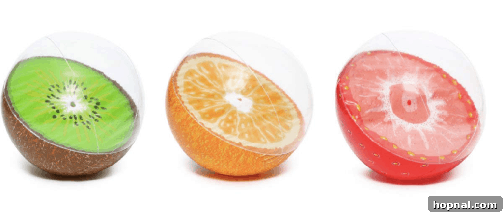 Colorful fruit-themed beach balls, perfect for pool or yard games at a summer party.