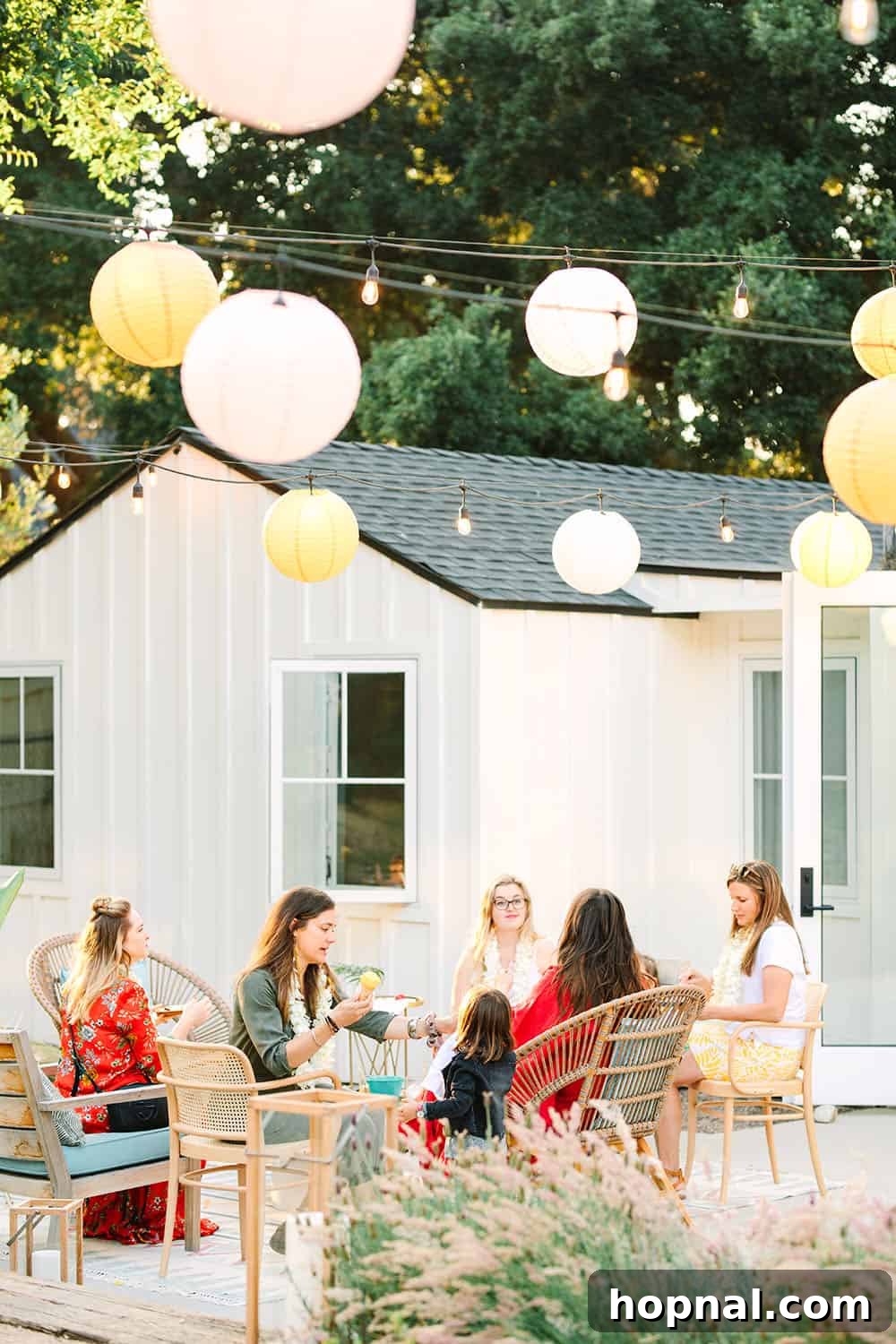 Decorative paper lanterns adding a festive touch to a backyard party setup.