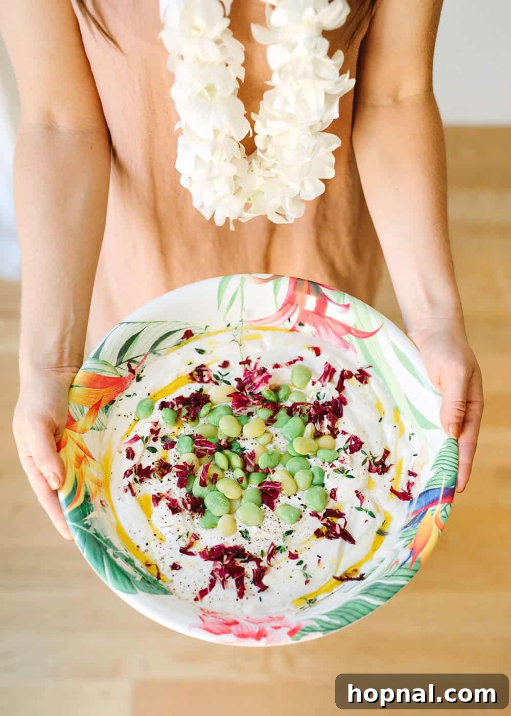 A creamy and savory yogurt dip, beautifully presented for a tropical party spread.