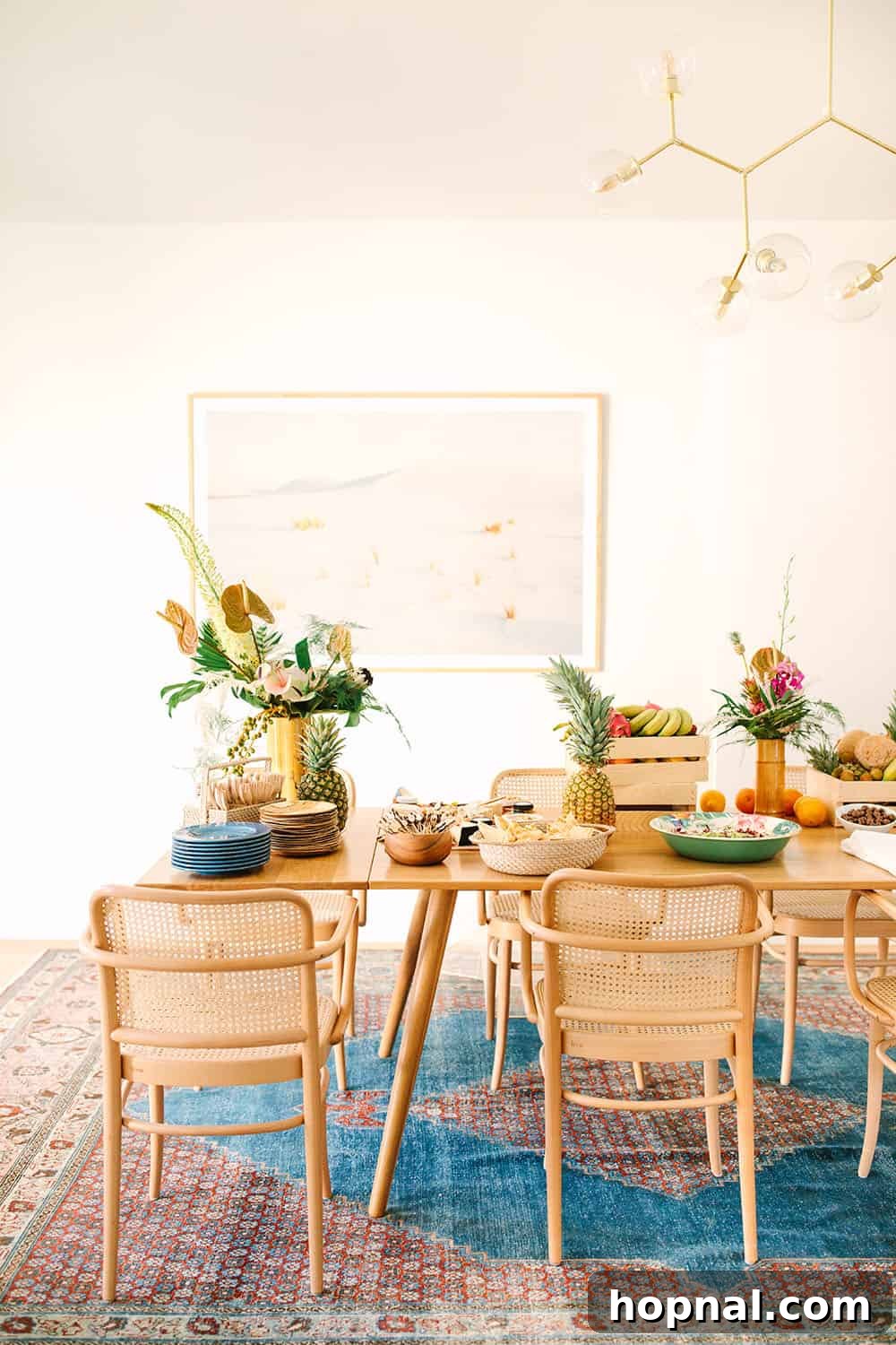 An inviting display of tropical party food and drinks set up in a dining room, creating a festive atmosphere.