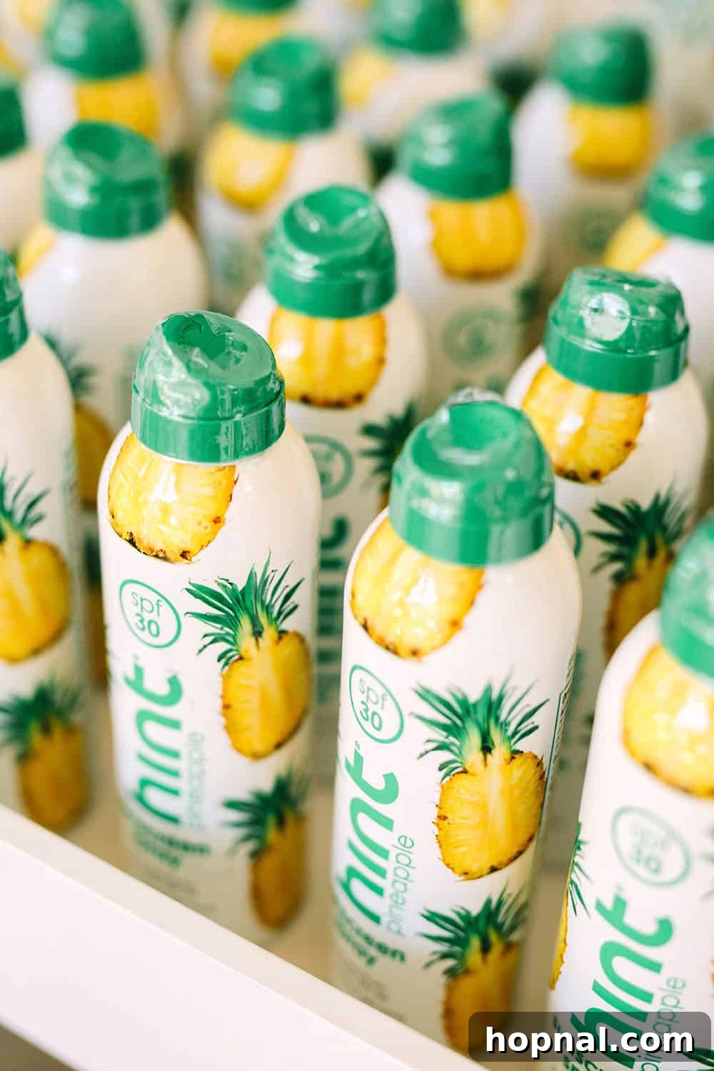 The best-smelling pineapple hint sunscreen, beautifully packaged as a tropical party favor for guests.