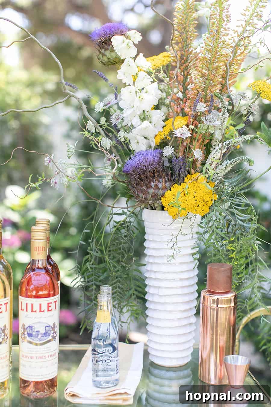 Craft Your Own Spritzer Bar 10 A elegant vase holding a bouquet of yellow flowers, adding a touch of natural beauty to the spritzer bar.