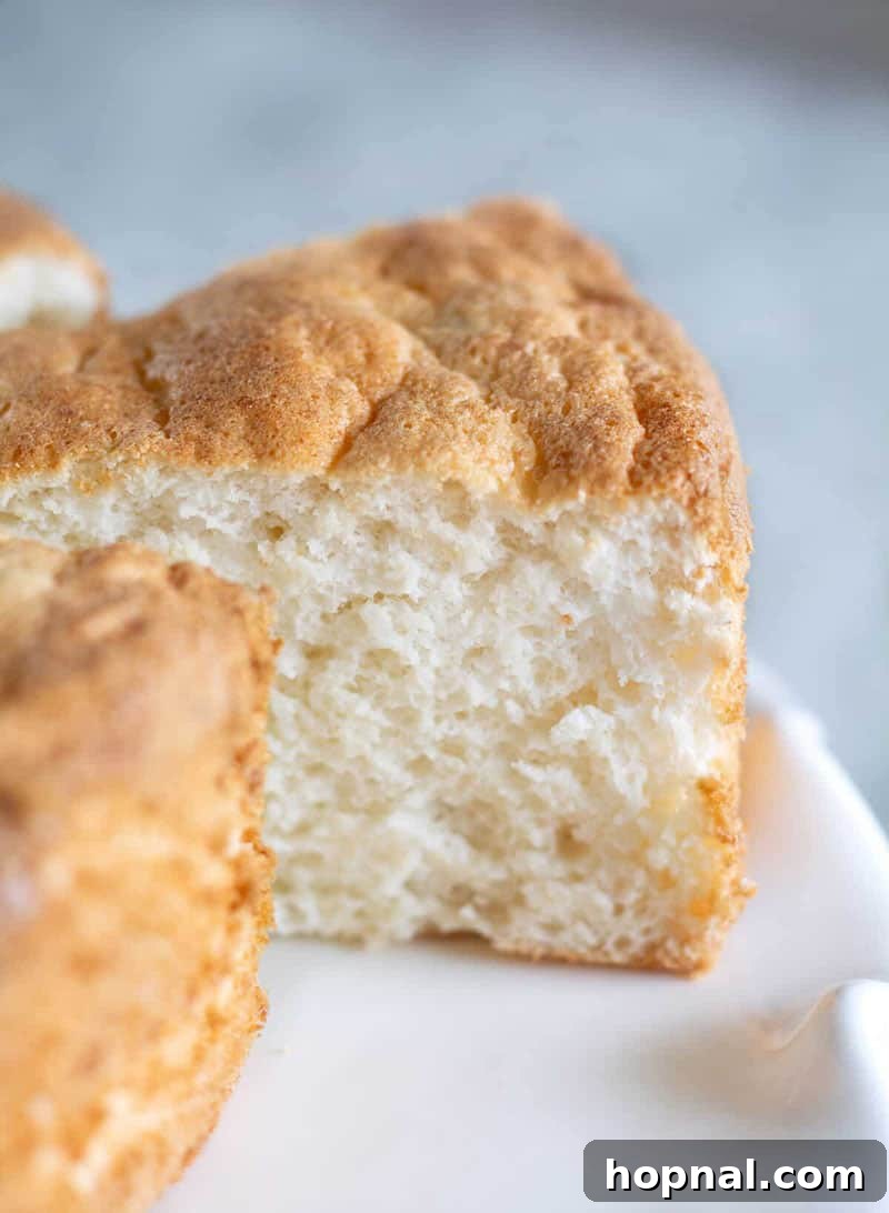 Close-up photo of a delicate Paleo and Keto Angel Food Cake, showing its light and airy texture.