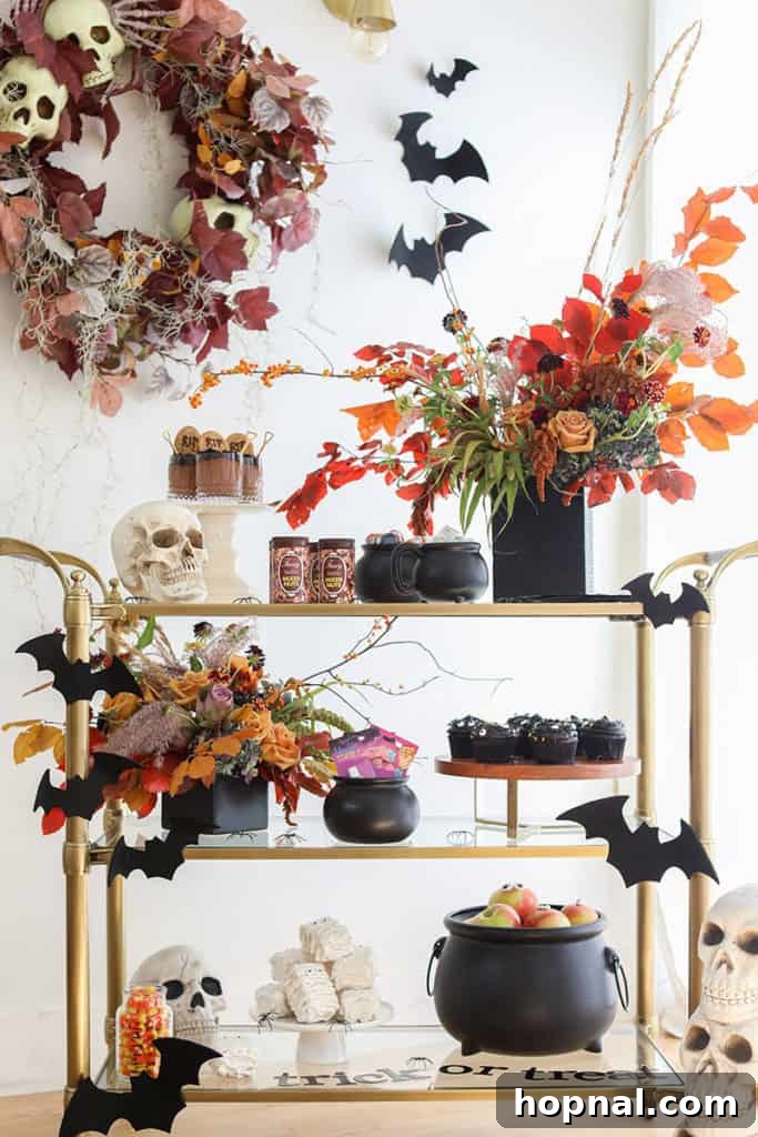 A 'Trick or Treat' bar setup for a Halloween party, featuring various candies, playful decorations, and spooky elements.