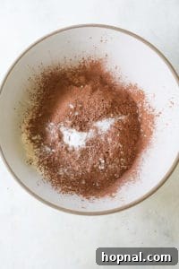 Dry ingredients for black velvet cupcakes in a mixing bowl.