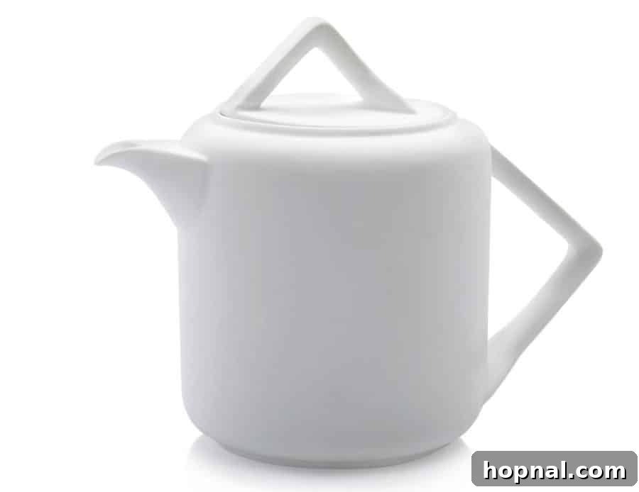 A classic teapot with a modern design, essential for serving hot tea gracefully.