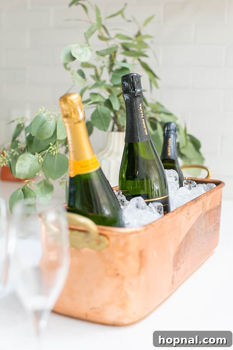 Chilled bottles of elegant Champagne, perfectly nestled in a stylish brass ice bucket from Williams Sonoma, ready to be served.