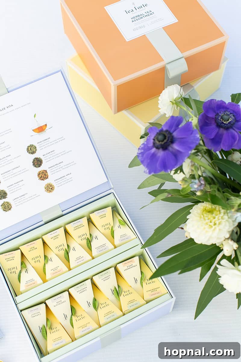 An open box of premium tea, revealing neatly arranged tea bags, inviting guests to choose their blend at a bridal shower tea party.