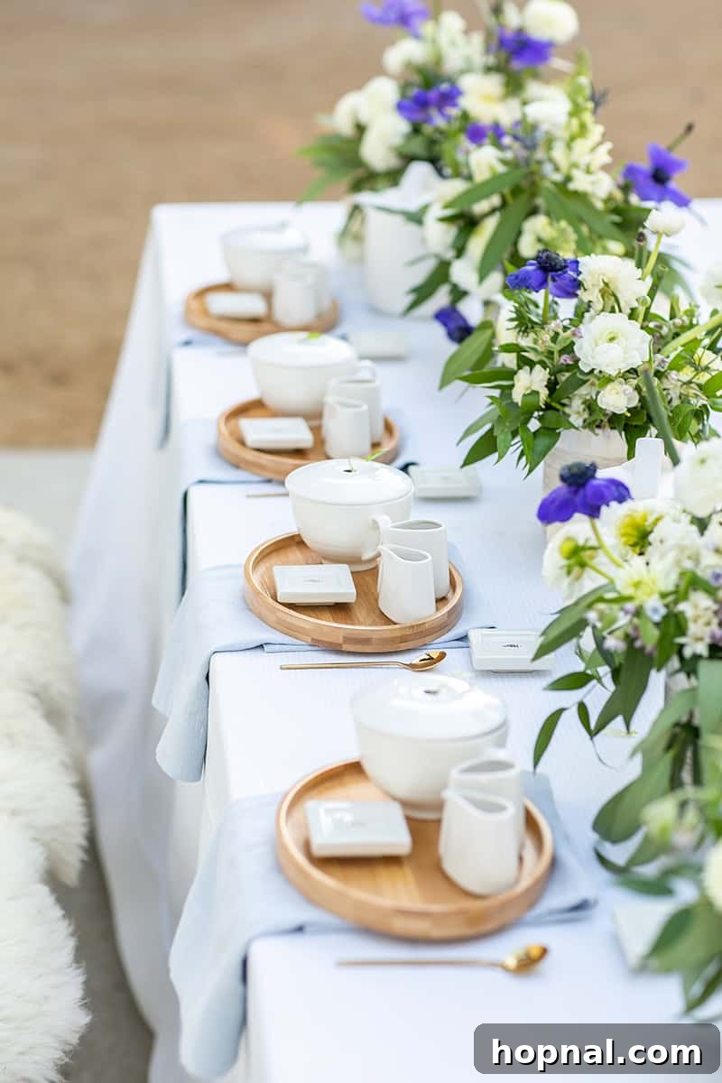 An exquisitely decorated tea party bridal shower setup, featuring lush floral arrangements, elegant linens, and charming tableware, creating an inviting atmosphere.