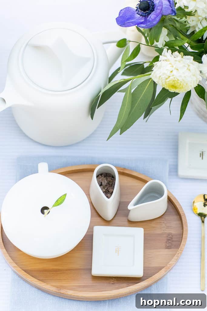 A vibrant display of assorted teas and charming tea party accessories.