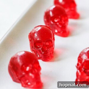 Finished skull jello shots arranged artfully on a serving tray, showcasing their spooky detail.