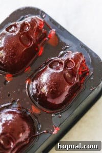 Releasing perfectly formed skull jello shots from the silicone mold.