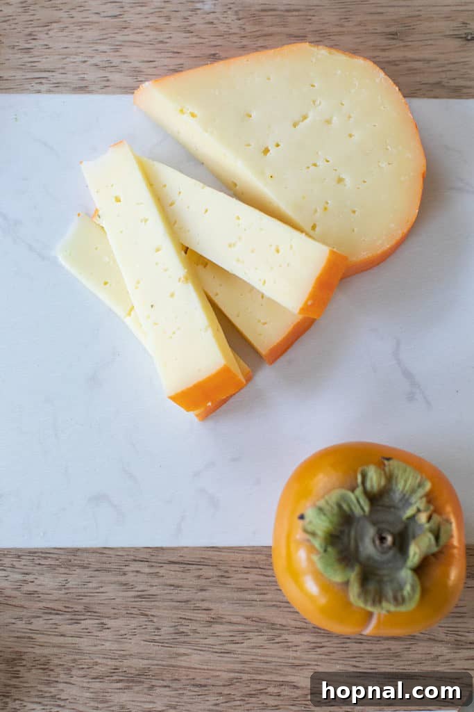 Assembling a cheese board for Thanksgiving. 