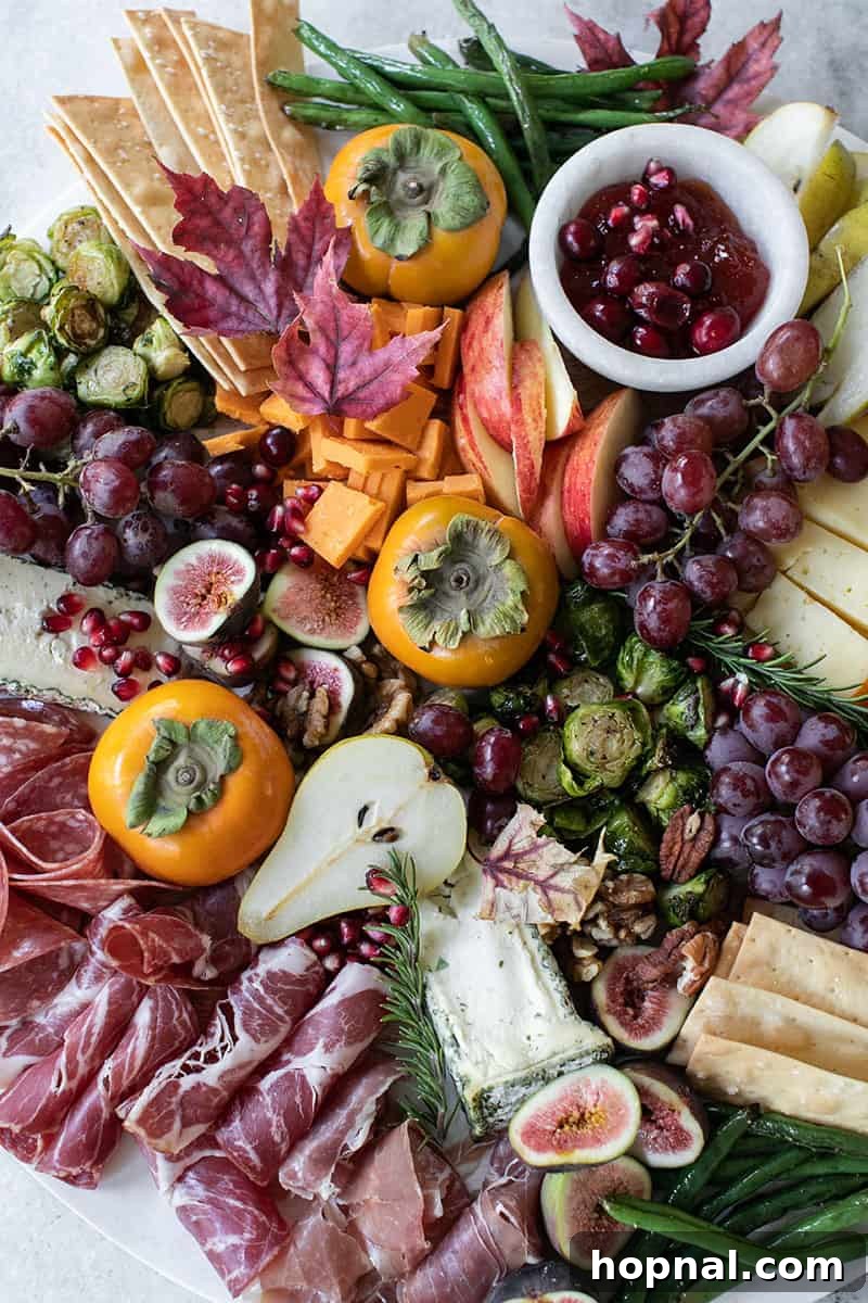 Cheese Board for fall with meat, cheese, pears, figs, apples, grapes and green beans. 
