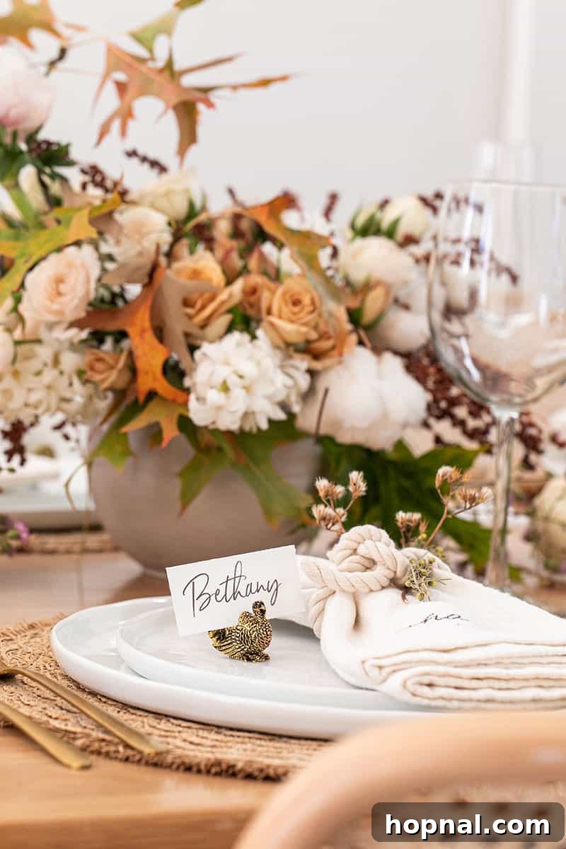 A charming small gold turkey card holder, adding a festive and personalized touch to the Thanksgiving table decor.