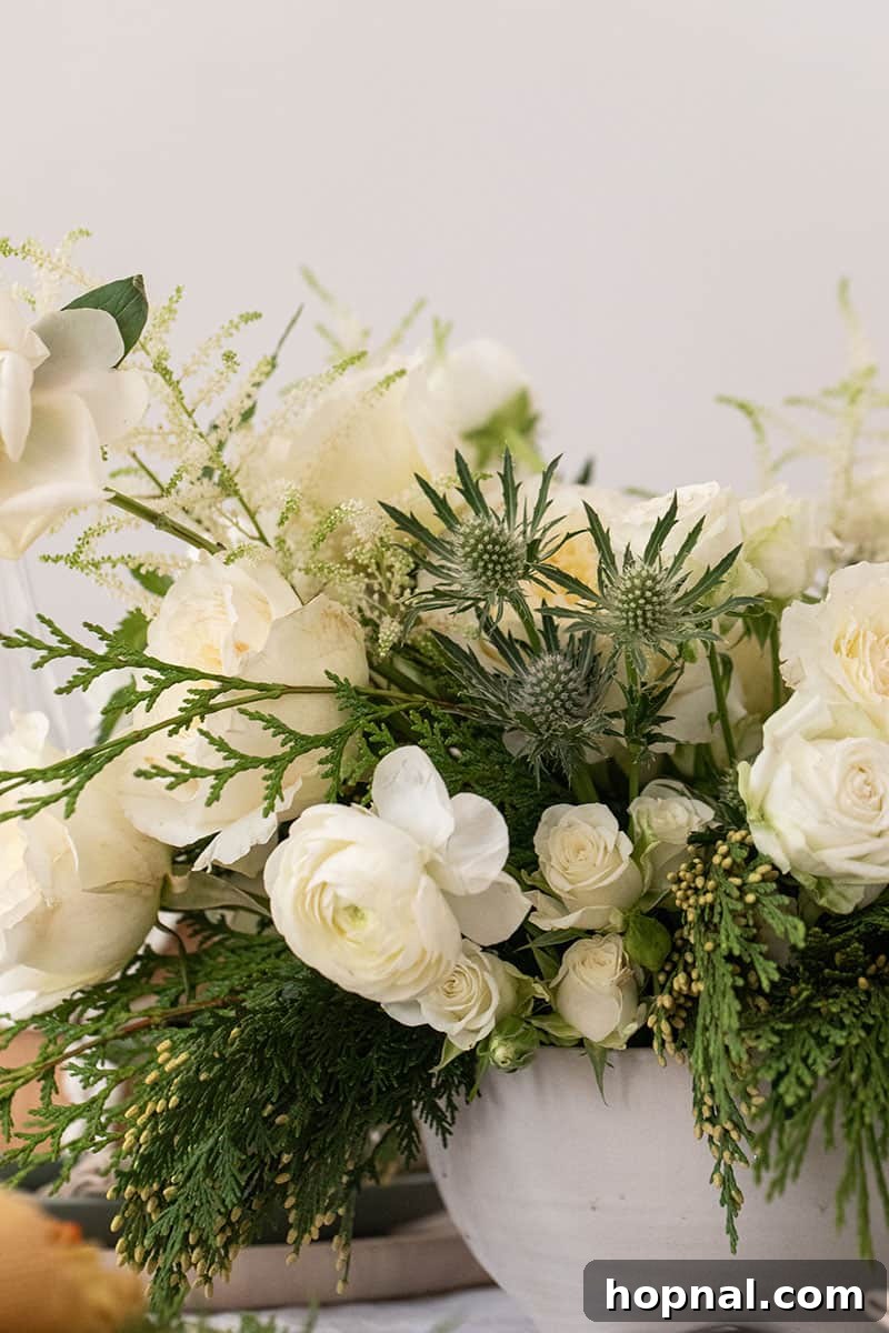 A fresh and elegant white and green winter flower arrangement, ideal for holiday decor.