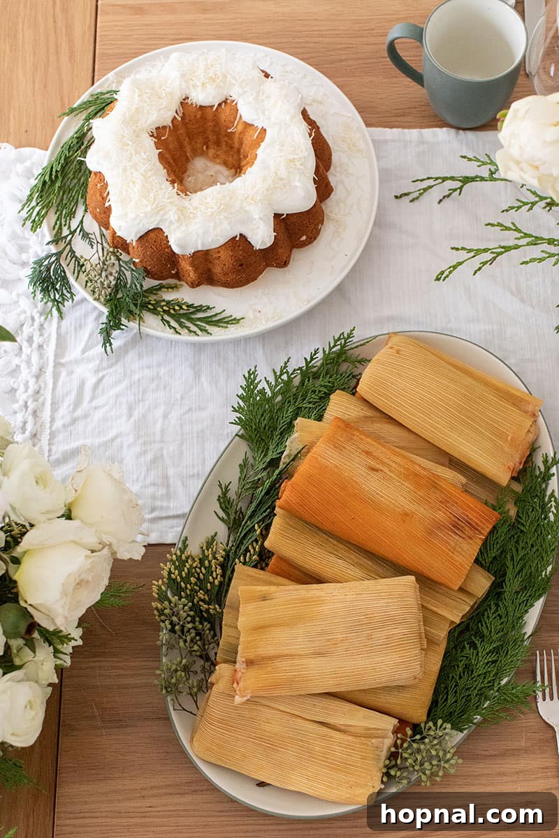A festive Christmas dinner spread featuring delicious tamales and a decadent coconut cake.