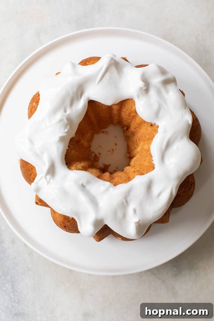 A slice of delicious cake with delicate icing, ready to be enjoyed at a casual holiday meal.