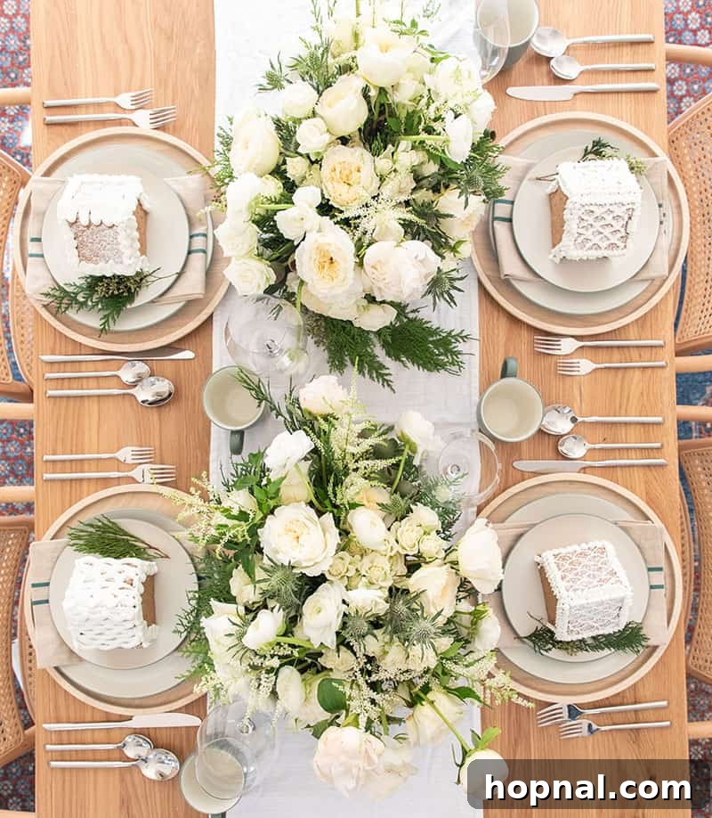 Elegant Christmas Eve Dinner Table Setting adorned with fresh flowers, exquisite plates, and a festive table runner.