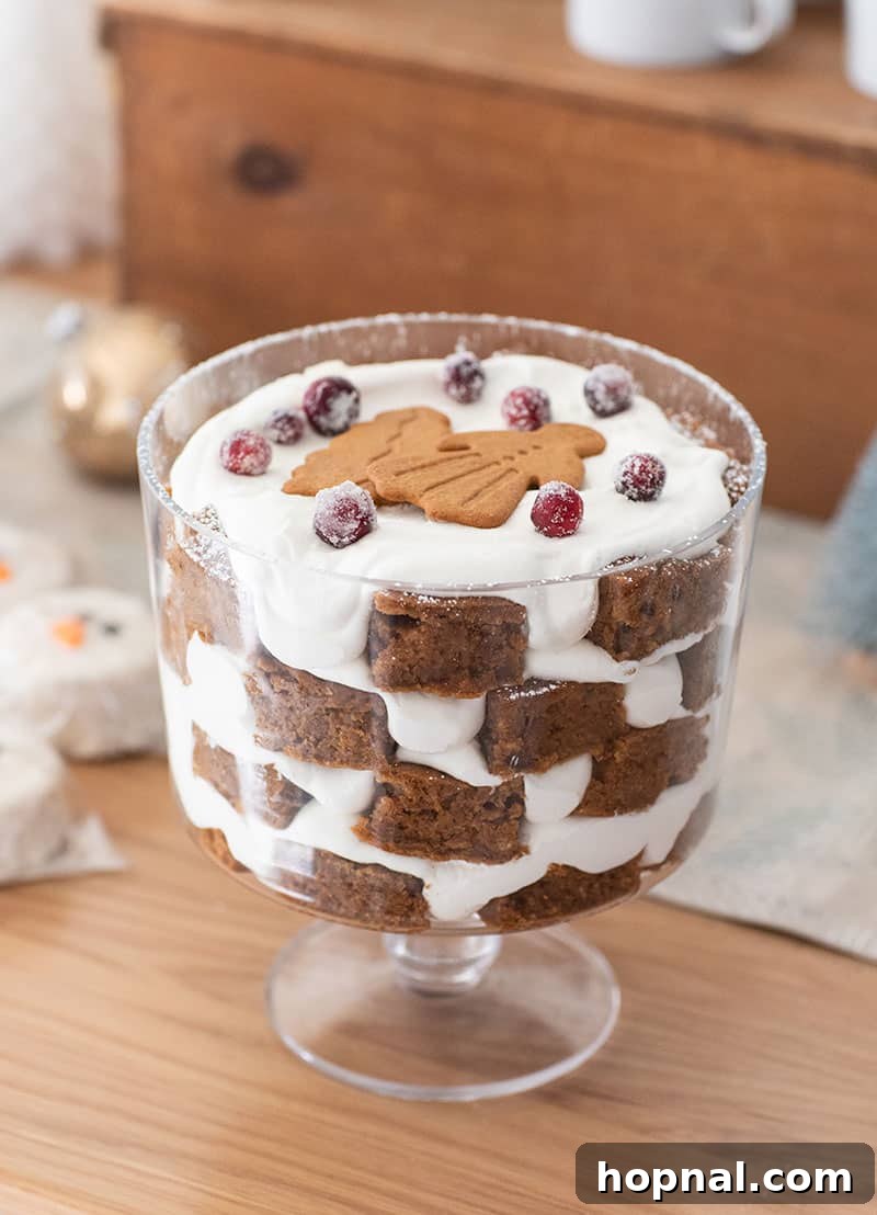 The Ultimate Guide to a Showstopping Christmas Dessert Display 13 A delightful gingerbread trifle, generously layered with whipped cream and gingerbread cookies.