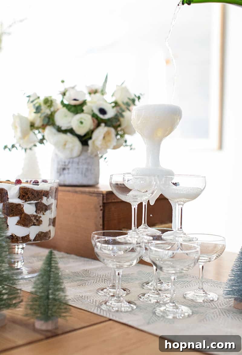 The Ultimate Guide to a Showstopping Christmas Dessert Display 19 A stunning champagne tower created with elegantly stacked coupe glasses, waiting for a celebratory pour.