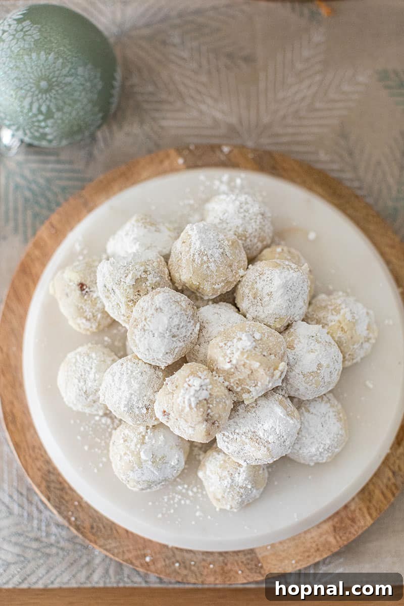 The Ultimate Guide to a Showstopping Christmas Dessert Display 23 Platter filled with classic snowball cookies, a festive and delicious holiday treat.