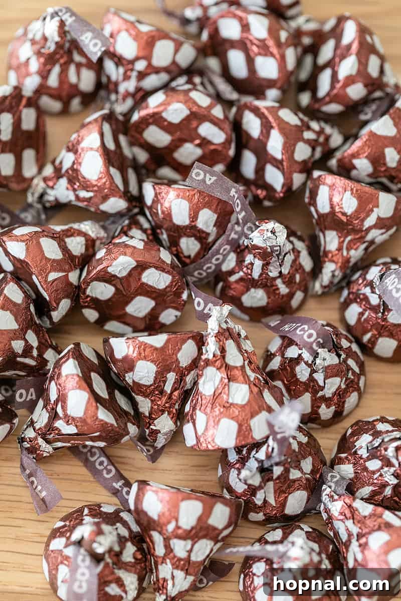 Santa's Snack Tray for Kids 8 A close-up shot of delightful Hot Chocolate Hershey Kisses, perfectly arranged, signaling a sweet, cozy, and irresistible treat for a holiday appetizer platter for kids.