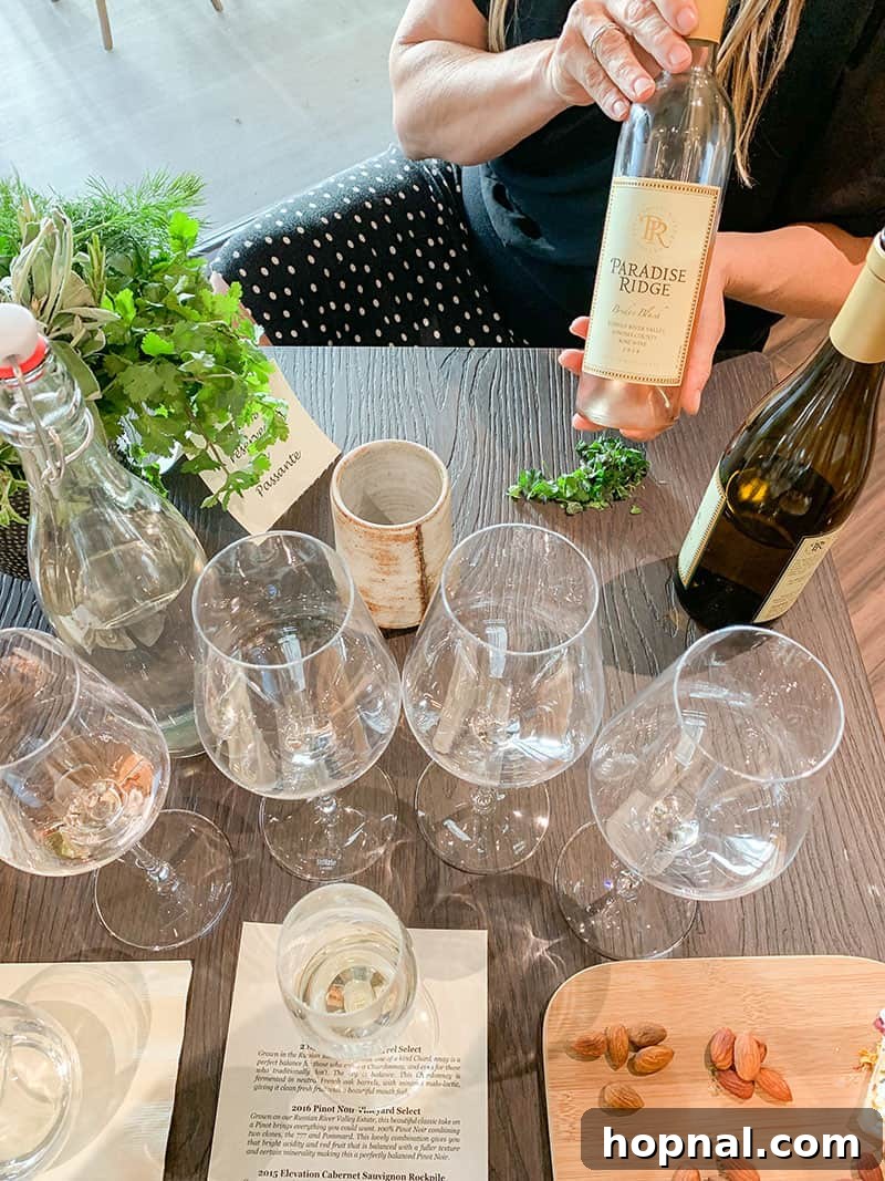 An elaborate Herb and Wine tasting setup at Paradise Ridge Winery, with a table full of glasses
