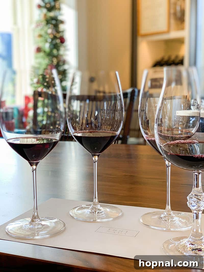 Four wine glasses filled with exquisite red wine at 1881 Napa