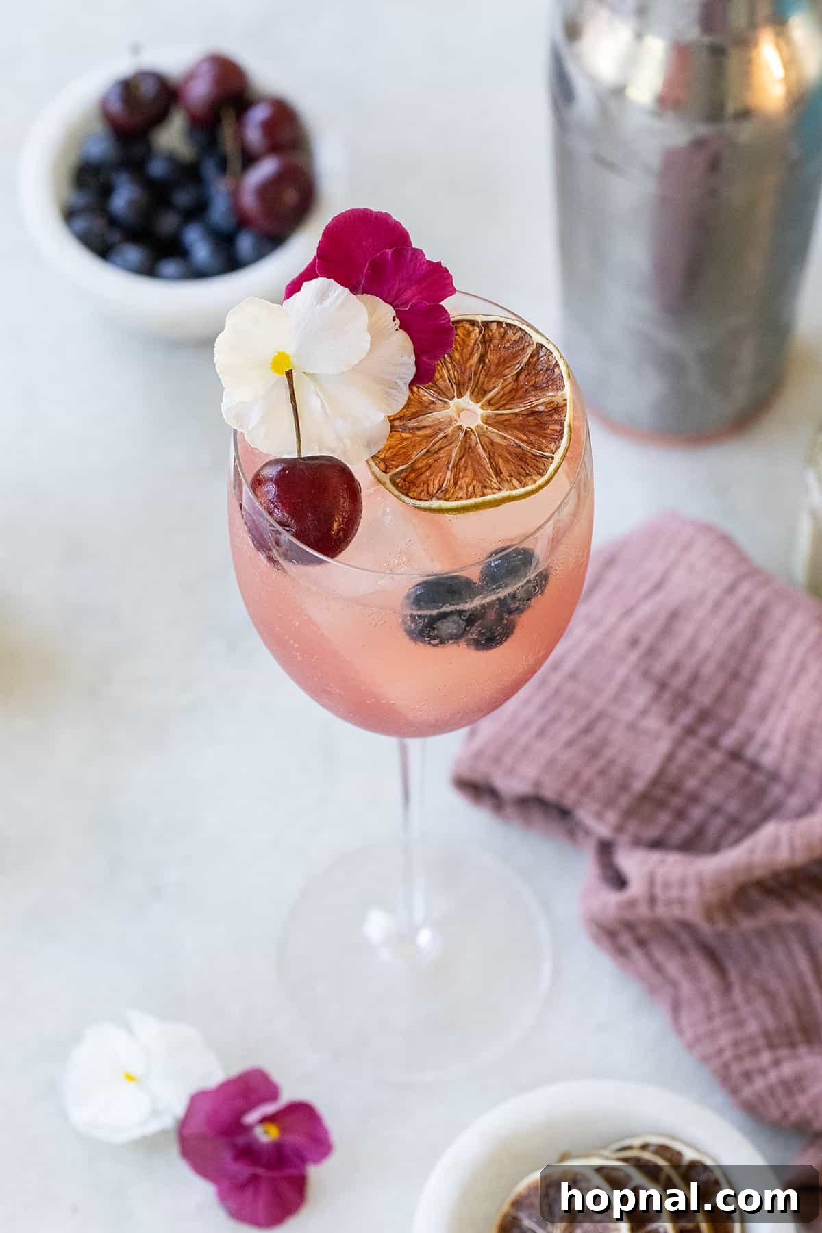 A simple Gin Spritz recipe with pretty garnishes, ideal for Valentine's Day.