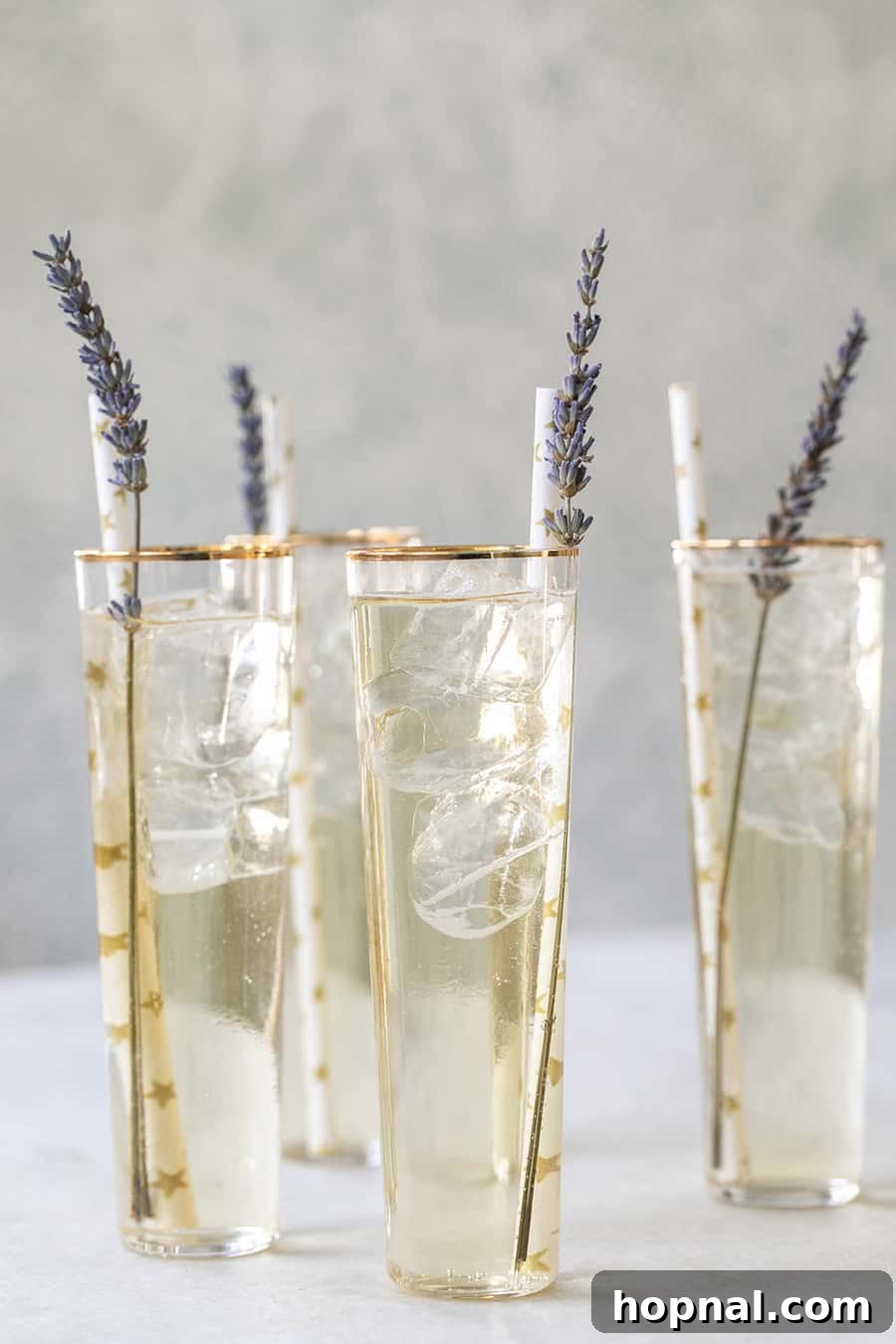 A refreshing French Spritz with a sprig of lavender for garnish.