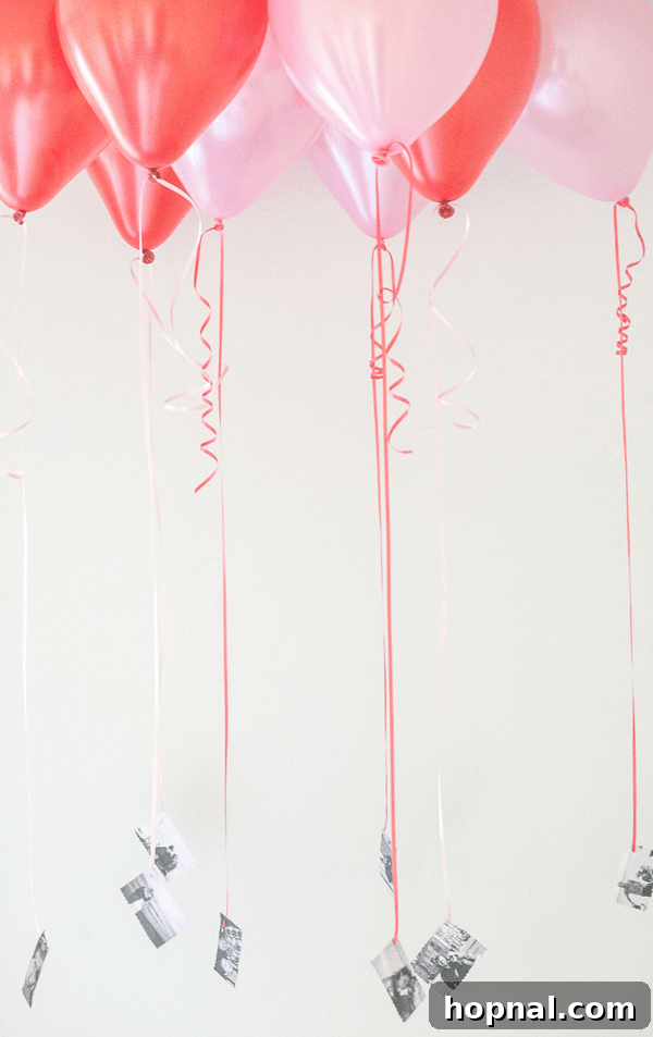 Heartfelt Creations: 14 DIY Valentine's Day Projects 6 A creative Valentine's Day 'Blast from the Past' balloon path, featuring pink and red balloons with cherished black and white photos attached.